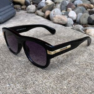 Gucci Black Sunglasses with Gold Detailing
